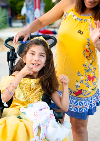 A young girl on an assistance chair