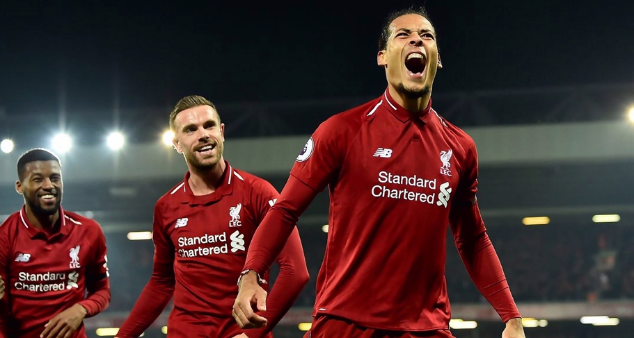 Liverpool football players in red jerseys with Standard Chartered sponsorship branding