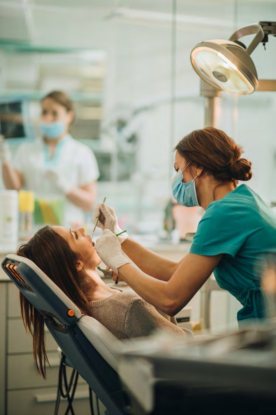 A patient undergoing a checkup from a dentist