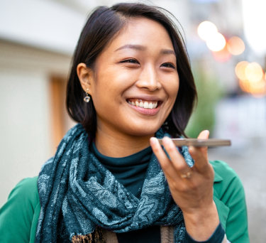 woman on the street talking on a phone