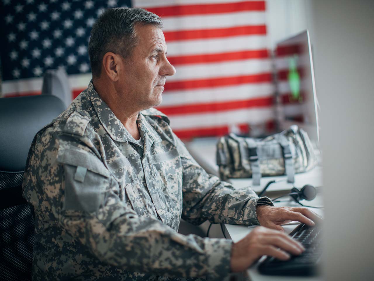 Soldier working on a computer.