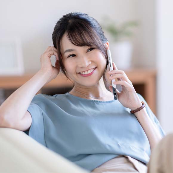 A happy senior businesswoman talking to somebody on the phone