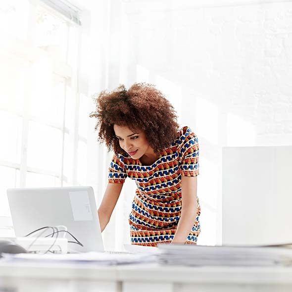 Young business woman working on a laptop