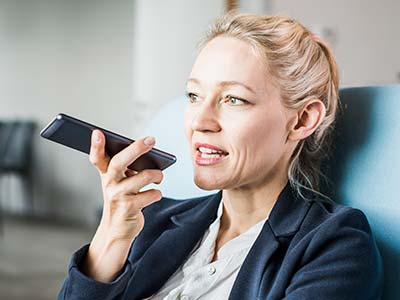 Businesswoman using cell phone 